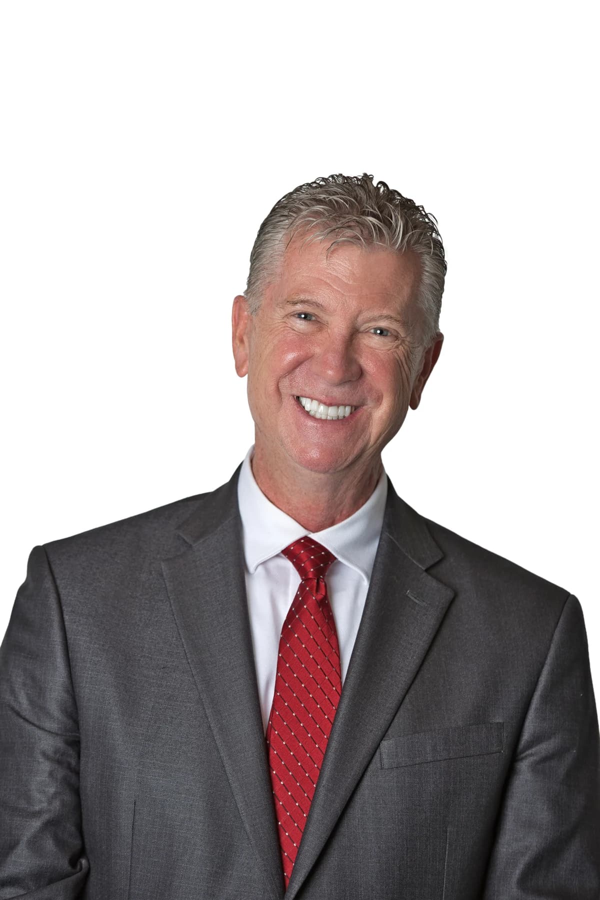 Bob Crews smiling in a dark suit and red tie