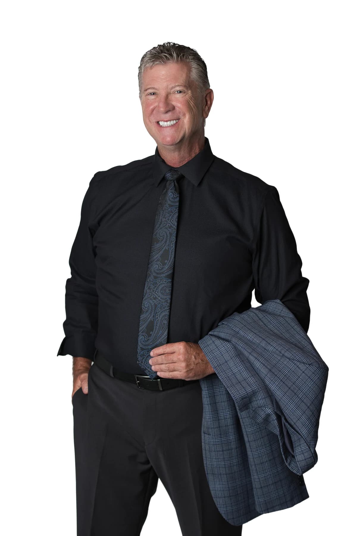 Bob Crews holding his jacket, wearing a black shirt and blue tie