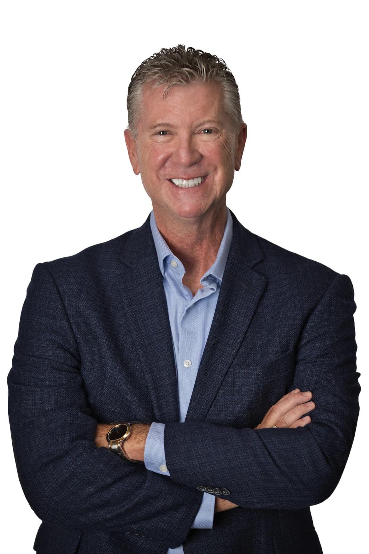 Bob Crews with arms crossed in a blue jacket and blue shirt