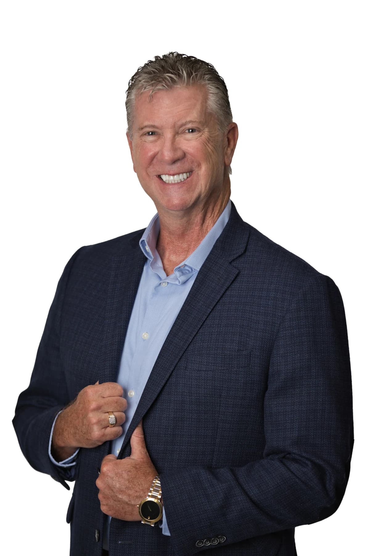 Bob Crews holding his lapel, wearing a blue jacket and blue shirt